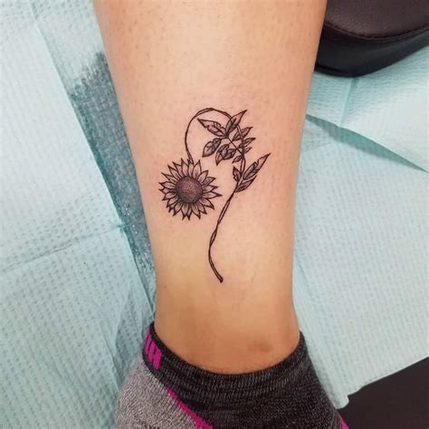 small foot tattoos for females|sunflower tattoo on foot.